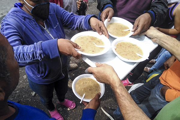 Food distribution to refugees at Alberque Douglas center