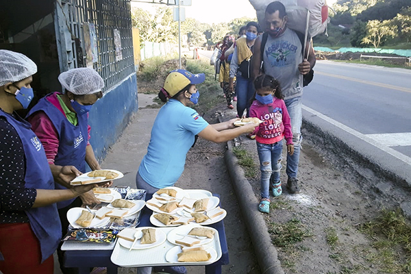 Volunteers distribute food