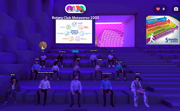 Member avatars sit in a virtual room with a deep purple backdrop.