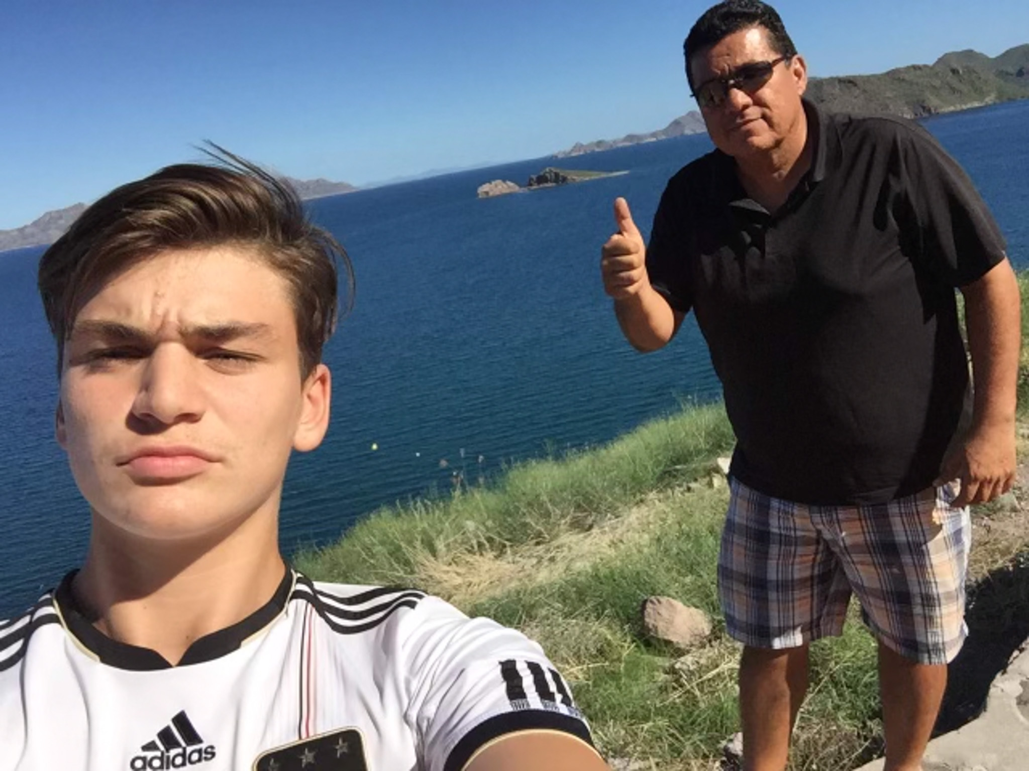 Gregor Baum and host dad by the bay.