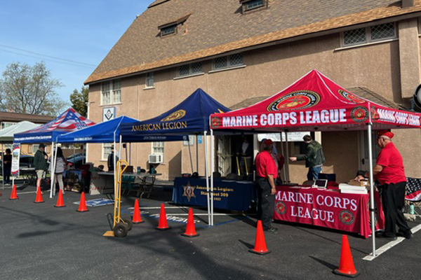 American Legion, Marine Corps League, and other shelters set up to support a food drive.